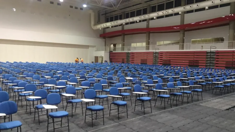 Auditorium filled with chairs for a large event